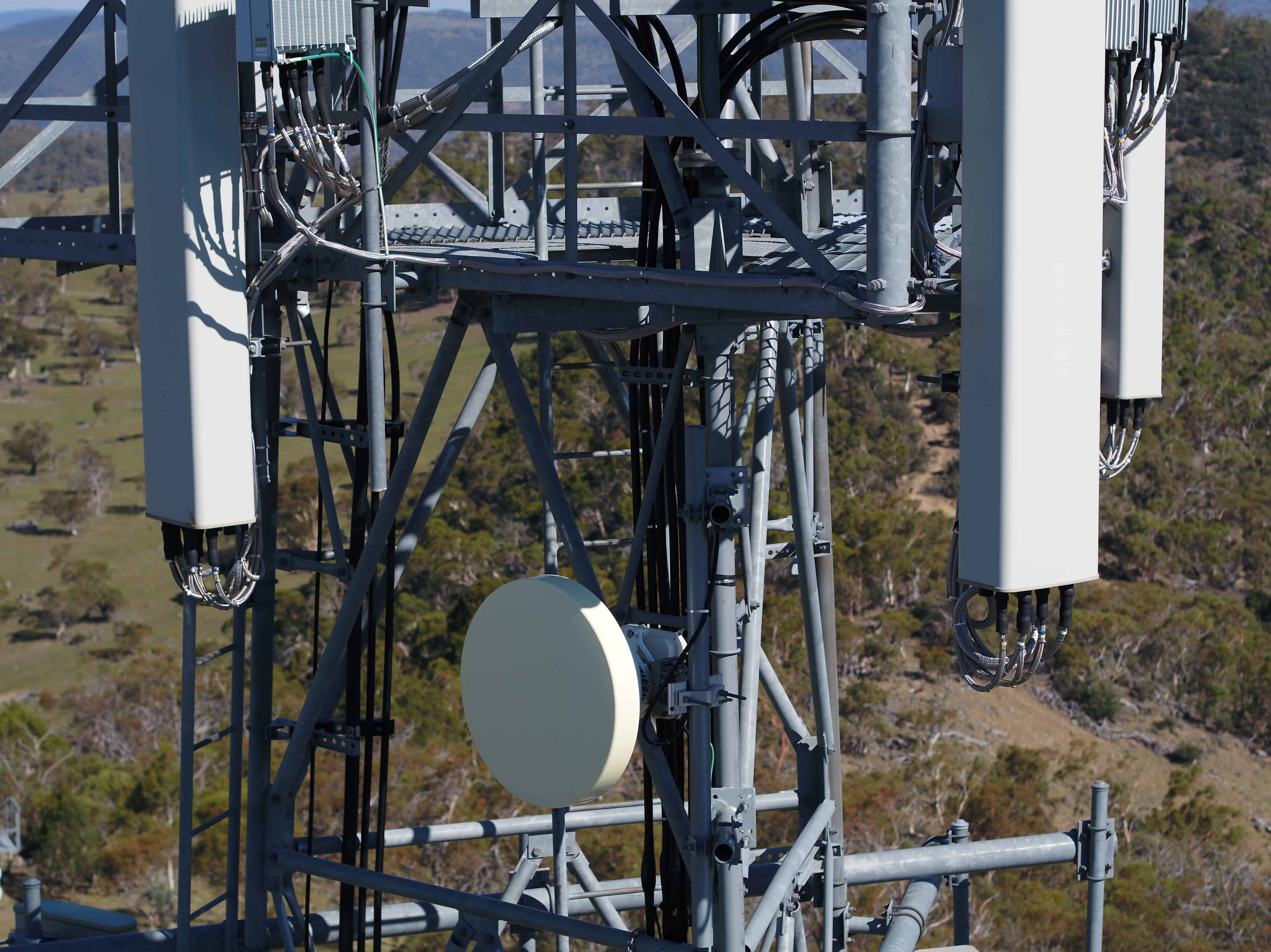 Bolts securing a vertical pole beside an antenna, enlarged from the same Broadcast Australia · tower inspection